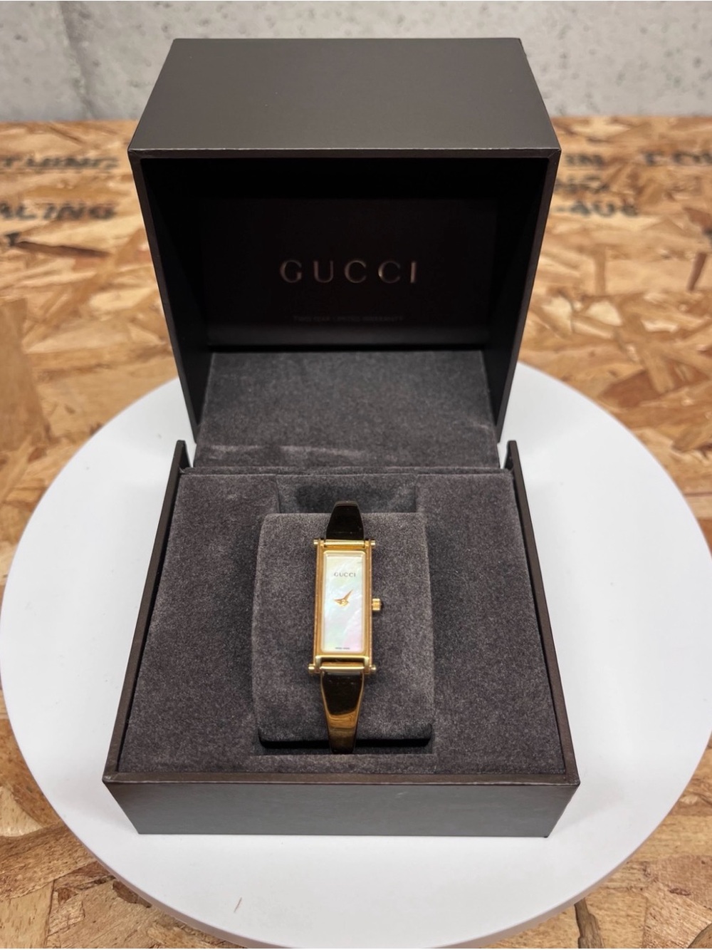 Gucci Gold Tone Bracelet Watch with Red Accent